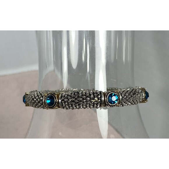 SILVER WITH GOLD ACCENTS & BLUE TOPAZ COLORED STONES. 7 STONES ON BRACELET - Picture 2 of 3